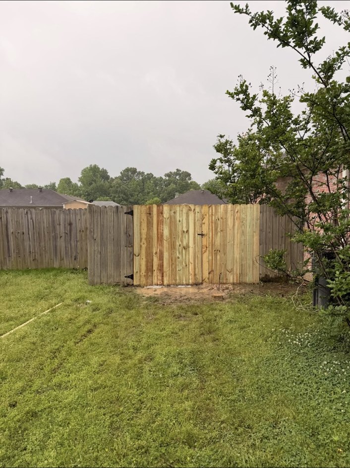 Freshly built wood privacy gate from a Dash home improvement project